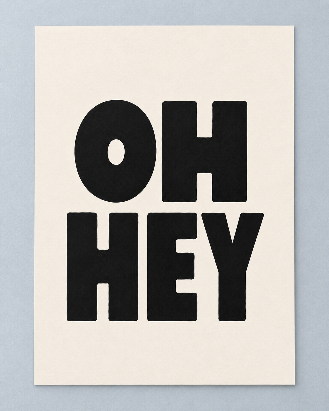A minimalist typographic art print featuring the words 'OH HEY' in bold black letters on an off-white background, displayed against a light gray wall.