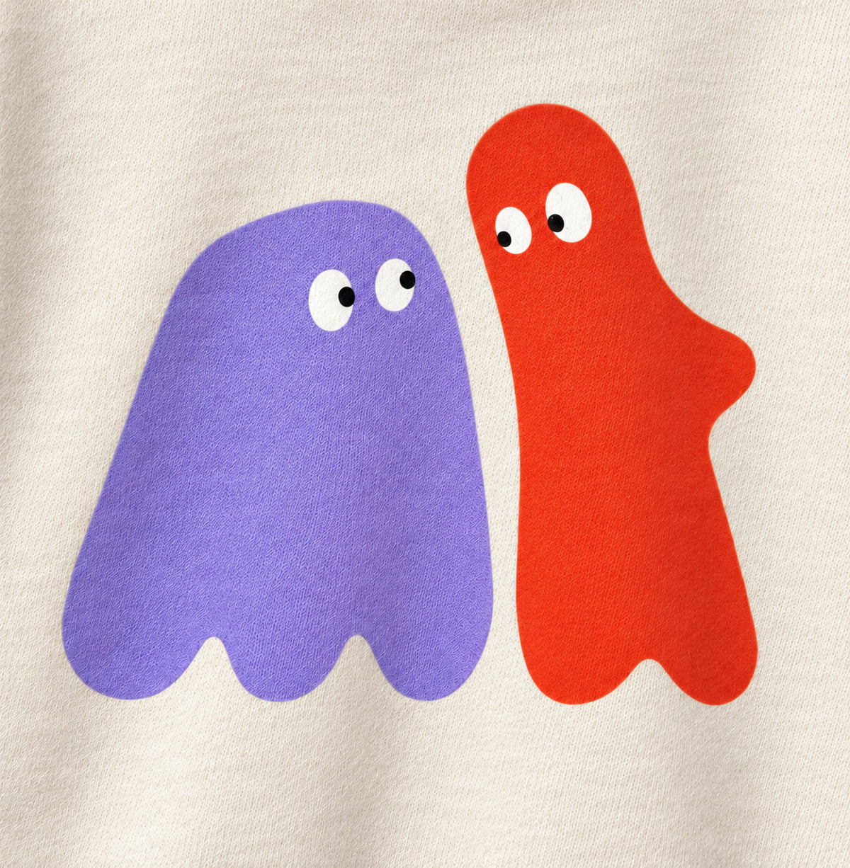 Close-up of lilac and red-orange ghosts looking at each other, printed on cream sweatshirt fabric.